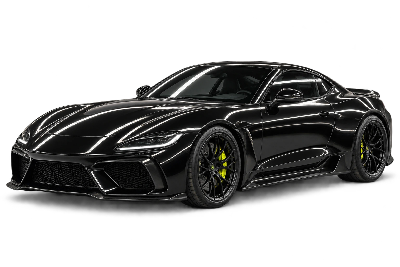 Gloss black sports coupe under studio inspection lighting